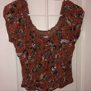 Orange floral ruffle shirt  patterned with flowers